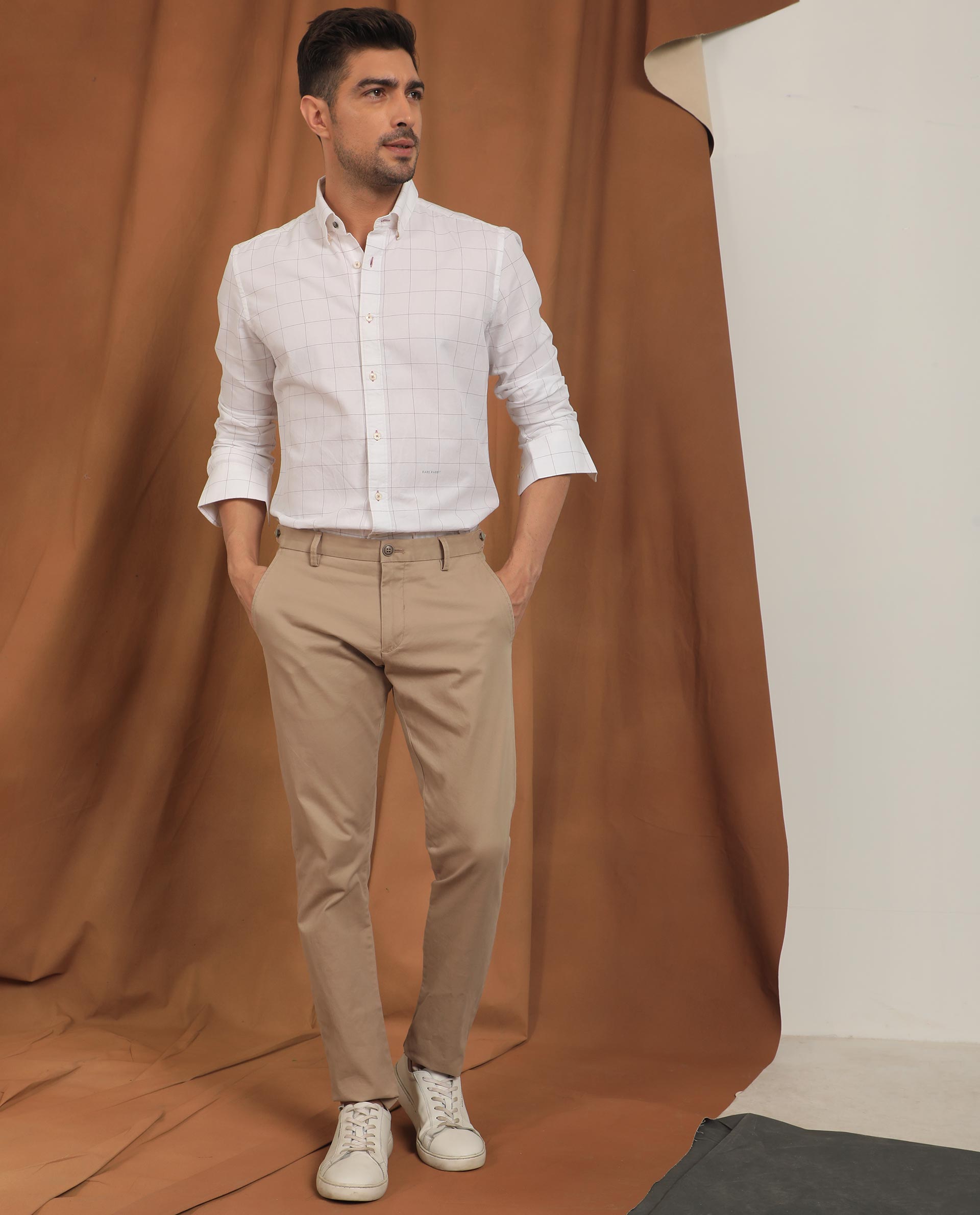 Man - Man in white shirt and brown pants - CleanPNG / KissPNG